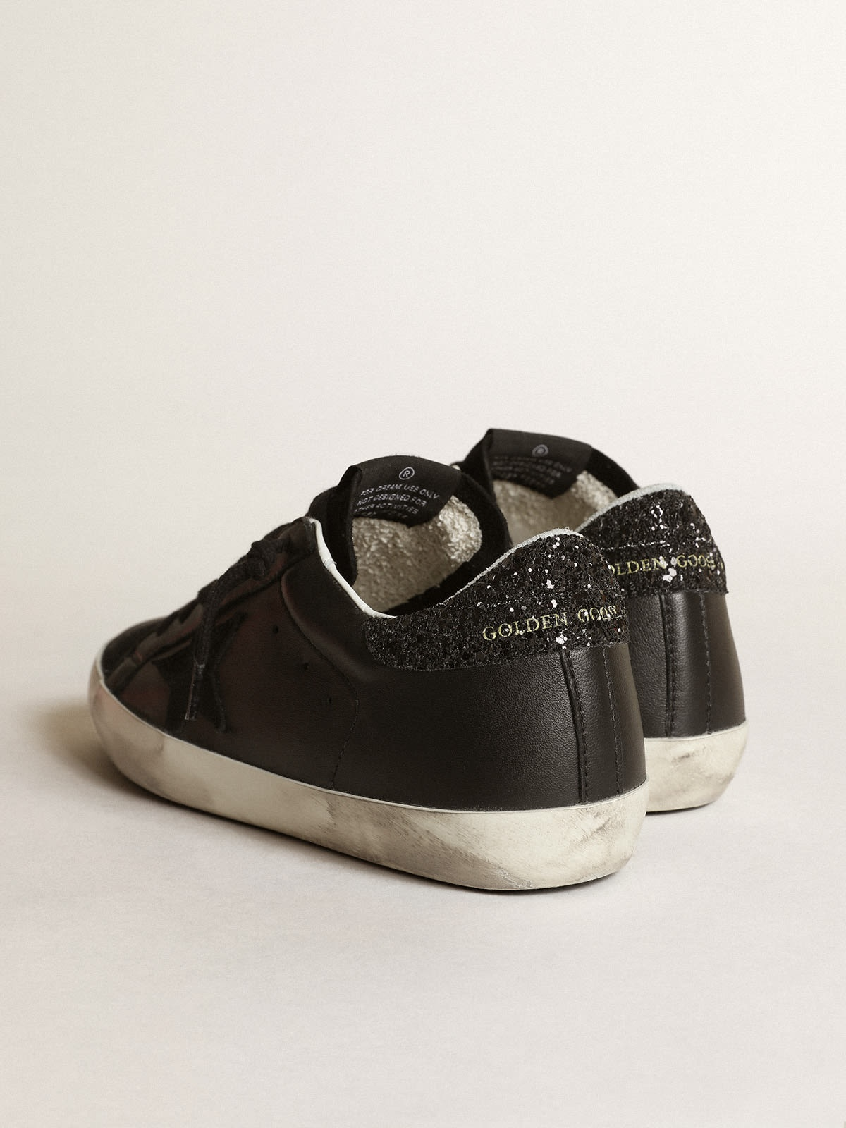 Super-Star in black nappa with black star and glitter heel tab